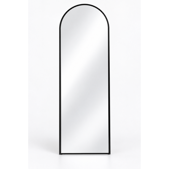 Halo arch floor mirror styled in a bright bedroom setting