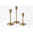 Three candle holders in antique brass finish, shown at varying heights on a clean white background.