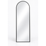 Halo arch floor mirror styled in a bright bedroom setting